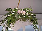 Wedding arbor with Oriental lilies, calla lilies and vines